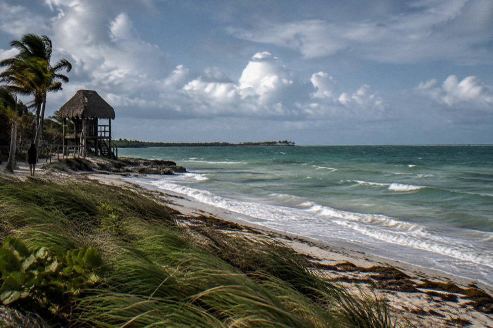 Open water horizon with scattered white clouds above the Caribbean coast